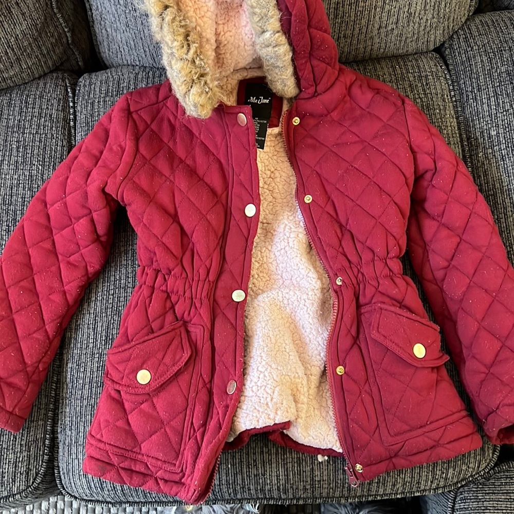 Burgundy coat with fur at the top